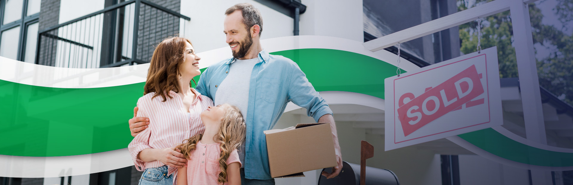 Happy Family Standing in front of newly purchased home with sold sign.